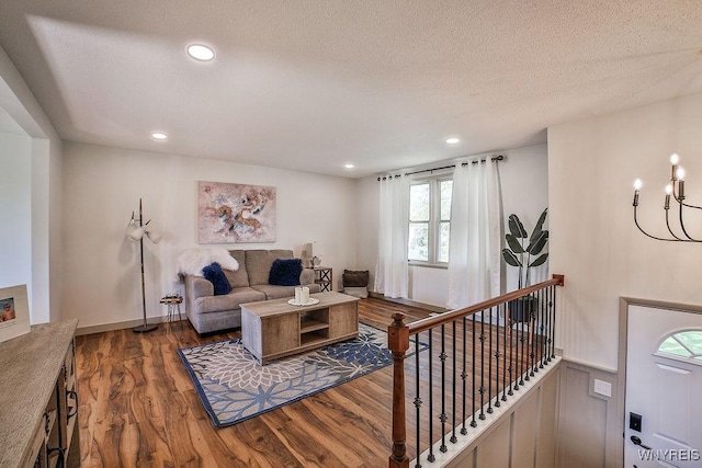 7025 Academy Ln, Lockport-Town, NY 14094 - living room featuring wood finished floors, a chandelier, a textured ceiling, and recessed lighting