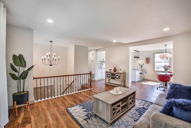 7025 Academy Ln, Lockport-Town, NY 14094 - living area featuring a chandelier, wood finished floors, recessed lighting, and baseboards
