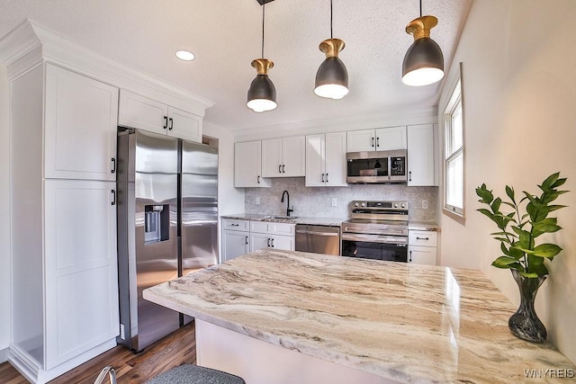7025 Academy Ln, Lockport-Town, NY 14094 - kitchen with appliances with stainless steel finishes, a sink, white cabinets, backsplash, and dark wood-style floors
