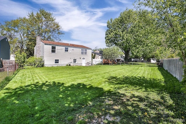 7025 Academy Ln, Lockport-Town, NY 14094 - rear view of property with a chimney