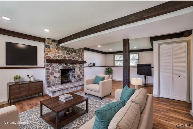 7025 Academy Ln, Lockport-Town, NY 14094 - living area featuring wood finished floors, beamed ceiling, a fireplace, baseboards, and recessed lighting