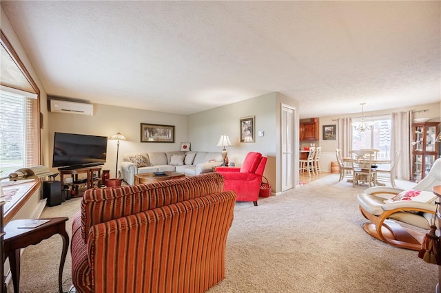 carpeted living area featuring a wall mounted AC and a textured ceiling