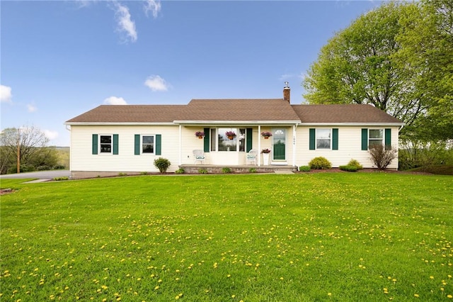 ranch-style house with a front lawn, a chimney, and a porch