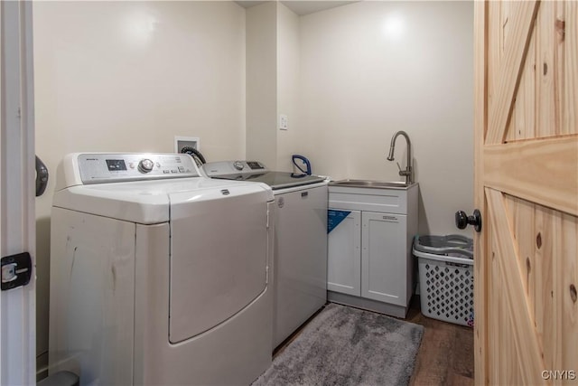 30622 Vanalstyne Rd, Clayton, NY 13622 - washroom with washer and clothes dryer, wood finished floors, and cabinet space