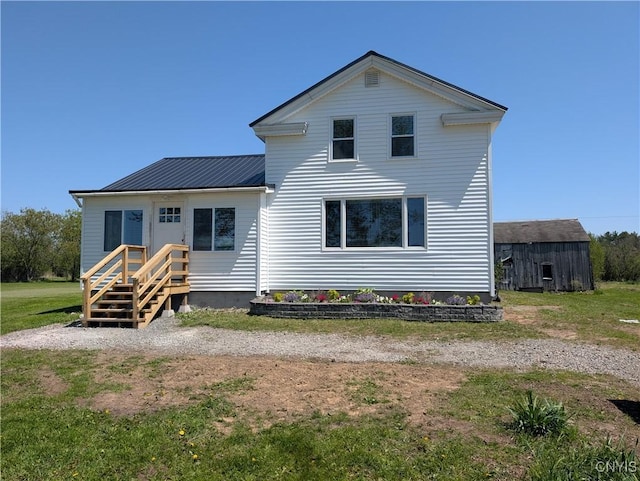 30622 Vanalstyne Rd, Clayton, NY 13622 - view of front facade with metal roof