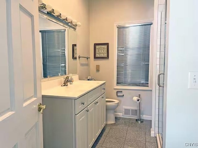 179 E Lake Rd, Deruyter, NY 13052 - bathroom featuring baseboards, granite floors, toilet, a shower stall, and vanity