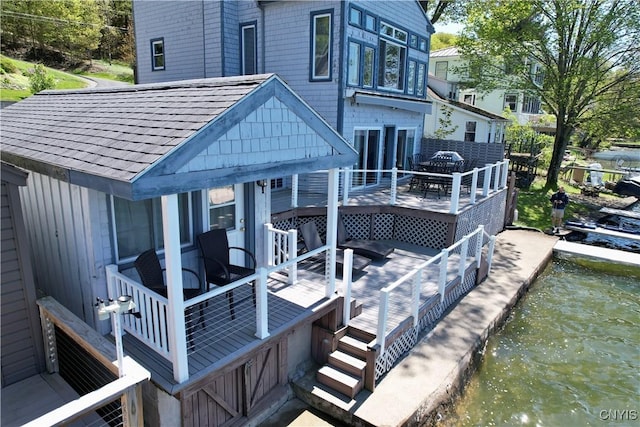179 E Lake Rd, Deruyter, NY 13052 - rear view of property featuring a deck with water view