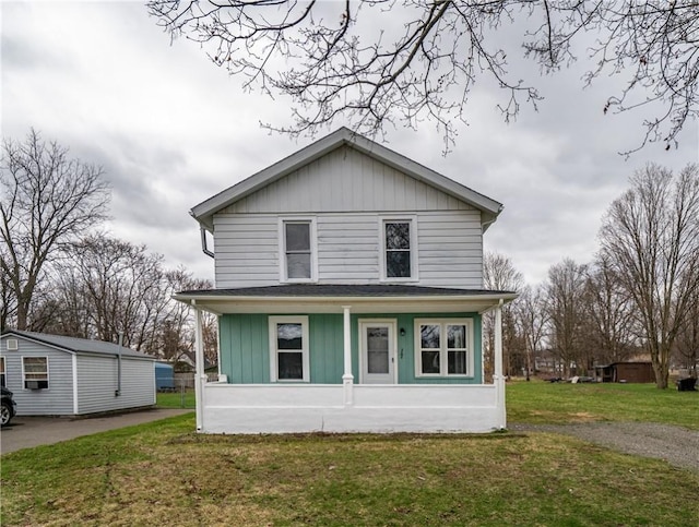 traditional style home featuring board and batten siding, a front lawn, and a porch