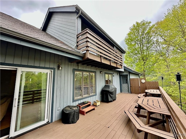 wooden deck with a grill
