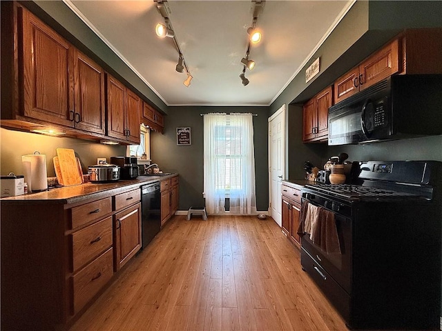 181 Dwight Ave, Corning-City, NY 14830 - kitchen with black appliances, a sink, track lighting, brown cabinetry, and crown molding