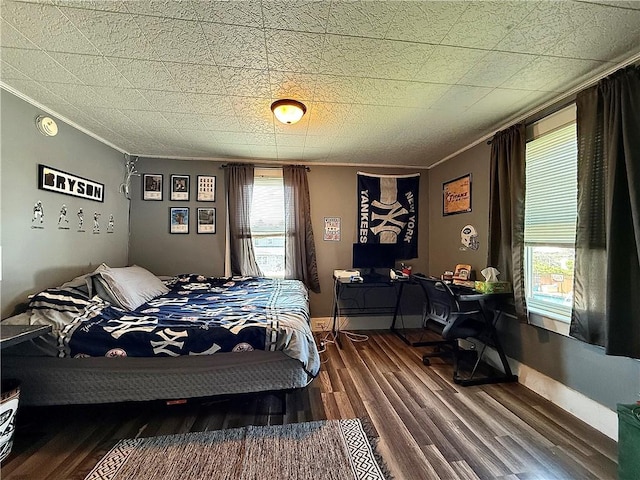 181 Dwight Ave, Corning-City, NY 14830 - bedroom with crown molding, wood finished floors, and a desk