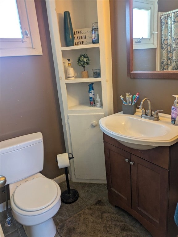 181 Dwight Ave, Corning-City, NY 14830 - full bathroom featuring toilet, vanity, and tile patterned floors