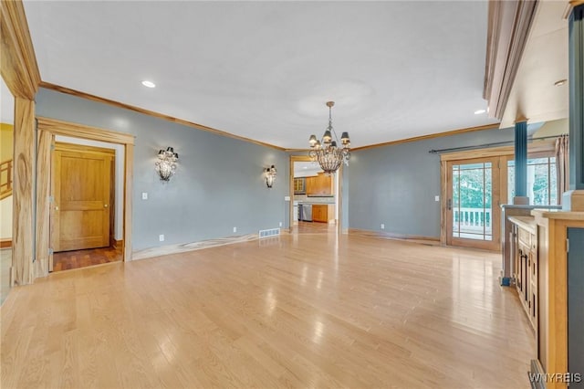 148 Mullen St, Tonawanda-City, NY 14150 - unfurnished dining area with a chandelier, light wood-type flooring, crown molding, baseboards, and recessed lighting