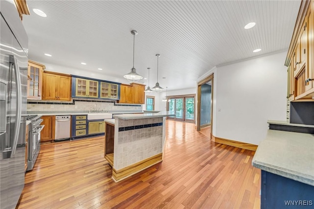 148 Mullen St, Tonawanda-City, NY 14150 - kitchen featuring a kitchen island, light wood-style floors, light countertops, pendant lighting, and recessed lighting