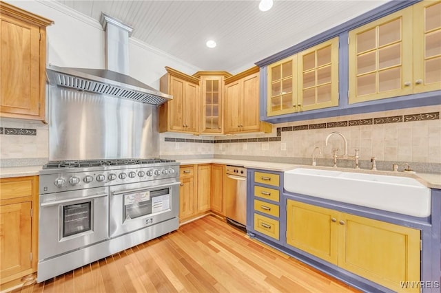 148 Mullen St, Tonawanda-City, NY 14150 - kitchen with double oven range, wall chimney exhaust hood, light countertops, a sink, and backsplash