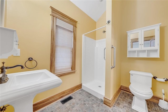 148 Mullen St, Tonawanda-City, NY 14150 - bathroom with a shower stall, a sink, toilet, baseboards, and vaulted ceiling