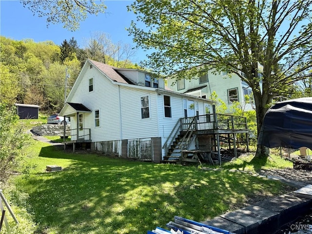 177 E Lake Rd, Deruyter, NY 13052 - rear view of property featuring stairs, a wooden deck, and a yard
