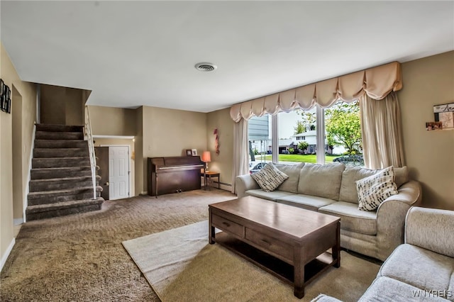 129 Summerview Rd, Amherst, NY 14221 - carpeted living room with a baseboard radiator, stairs, and baseboards