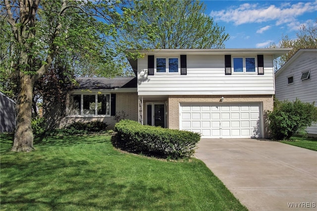 129 Summerview Rd, Amherst, NY 14221 - split level home with brick siding, a garage, driveway, and a front yard