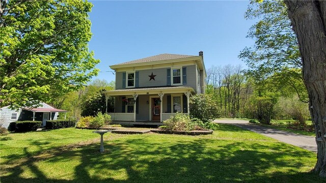 48 Division St, Maryland, NY 12155 - view of front of home featuring a porch, a front yard, and a chimney