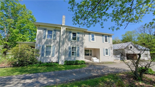 48 Division St, Maryland, NY 12155 - view of front of house featuring a chimney and driveway
