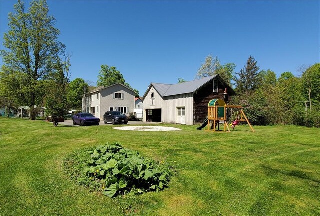 48 Division St, Maryland, NY 12155 - rear view of property featuring a yard and a playground