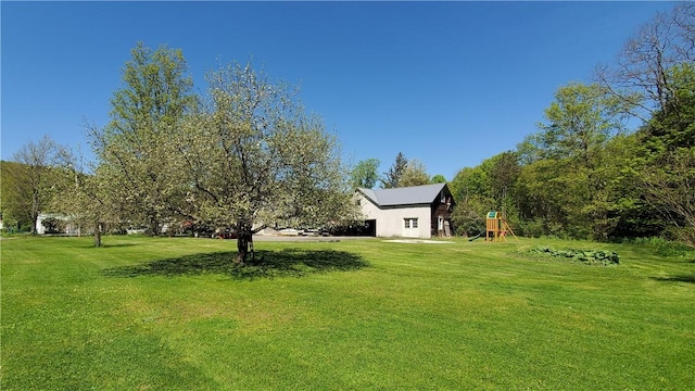 48 Division St, Maryland, NY 12155 - view of green lawn featuring a playground
