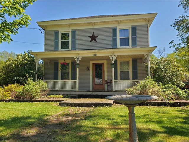 48 Division St, Maryland, NY 12155 - italianate home with a porch and a front yard