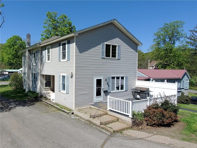 48 Division St, Maryland, NY 12155 - back of house with a chimney and a wooden deck
