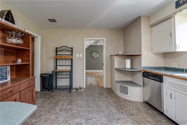 kitchen with dishwasher, white cabinetry, and open shelves