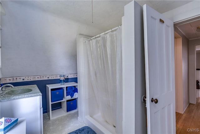 bathroom featuring a sink and a stall shower