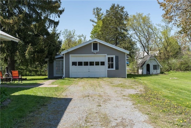 detached garage featuring driveway