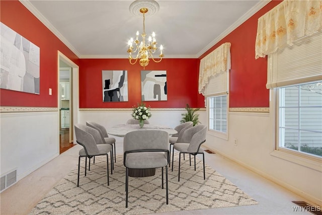 4179 Foxwood Ln, Clarence, NY 14221 - carpeted dining space featuring a chandelier, crown molding, and baseboards
