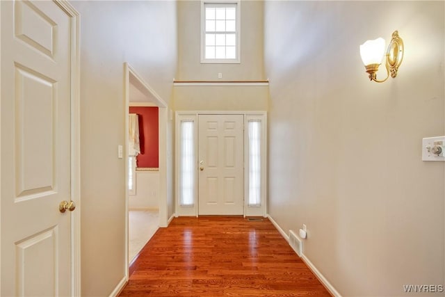 4179 Foxwood Ln, Clarence, NY 14221 - entrance foyer featuring a high ceiling, wood finished floors, and baseboards