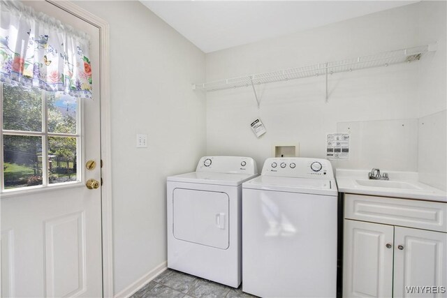 4179 Foxwood Ln, Clarence, NY 14221 - laundry room with washing machine and dryer, cabinet space, and baseboards