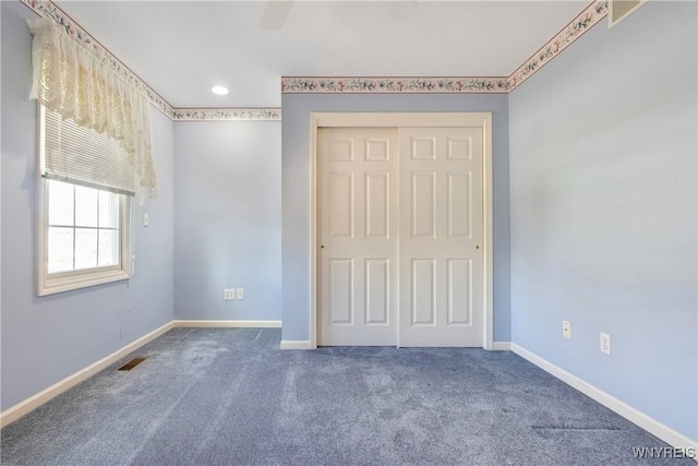 4179 Foxwood Ln, Clarence, NY 14221 - unfurnished bedroom with carpet flooring, a closet, baseboards, ceiling fan, and recessed lighting