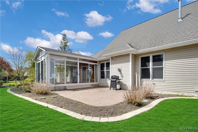 4179 Foxwood Ln, Clarence, NY 14221 - back of house with a sunroom, a patio, a shingled roof, and a lawn
