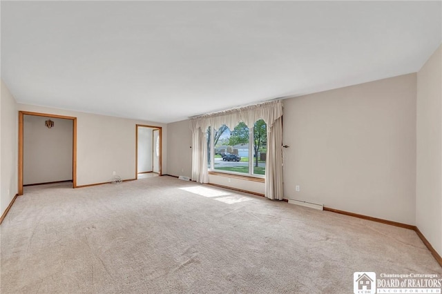20 Post Rd, Amherst, NY 14221 - empty room featuring carpet, baseboards, and baseboard heating