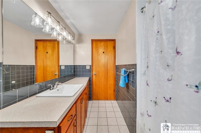 20 Post Rd, Amherst, NY 14221 - bathroom with tile walls, tile patterned flooring, a wainscoted wall, vanity, and curtained shower