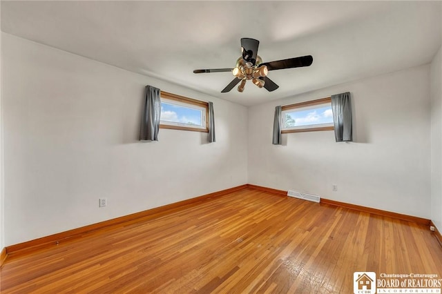 20 Post Rd, Amherst, NY 14221 - empty room with plenty of natural light, baseboards, light wood-style flooring, and a ceiling fan