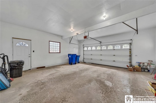20 Post Rd, Amherst, NY 14221 - garage featuring a garage door opener