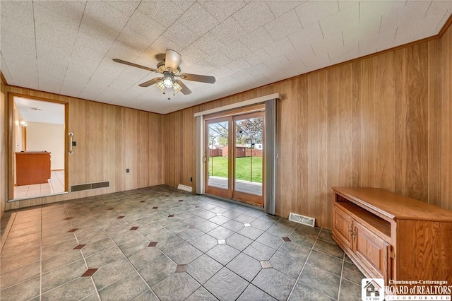 20 Post Rd, Amherst, NY 14221 - tiled empty room with a ceiling fan and wooden walls