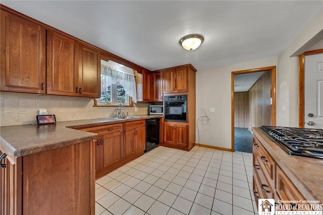 20 Post Rd, Amherst, NY 14221 - kitchen featuring black appliances, a sink, light tile patterned floors, backsplash, and brown cabinets