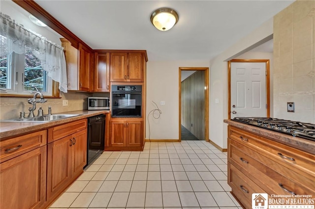 20 Post Rd, Amherst, NY 14221 - kitchen with black appliances, a sink, tasteful backsplash, and light tile patterned flooring