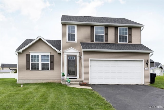 694 Pleasant View Dr, Lancaster, NY 14086 - traditional-style home with asphalt driveway, an attached garage, and a front lawn