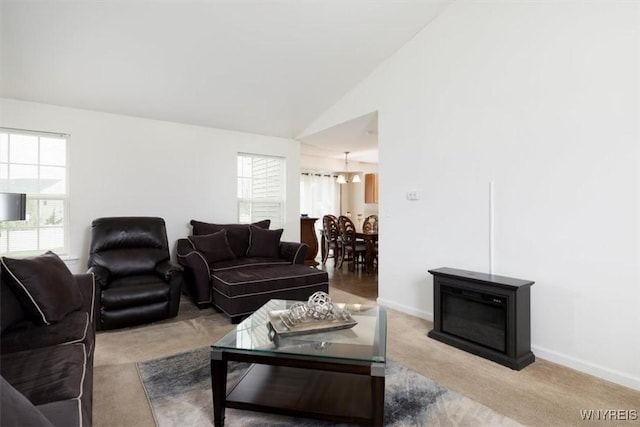694 Pleasant View Dr, Lancaster, NY 14086 - living area with carpet floors, baseboards, a chandelier, and high vaulted ceiling