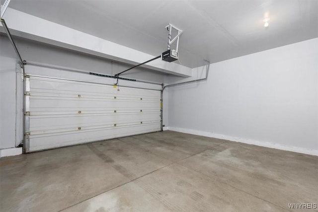 694 Pleasant View Dr, Lancaster, NY 14086 - garage with a garage door opener and baseboards
