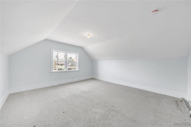 111 Roesch Ave, Buffalo, NY 14207 - additional living space with lofted ceiling, carpet floors, and baseboards