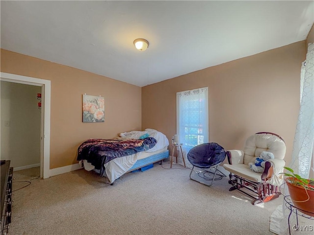 bedroom with carpet flooring and baseboards