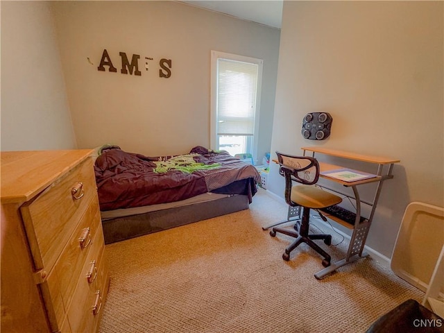 carpeted bedroom with baseboards